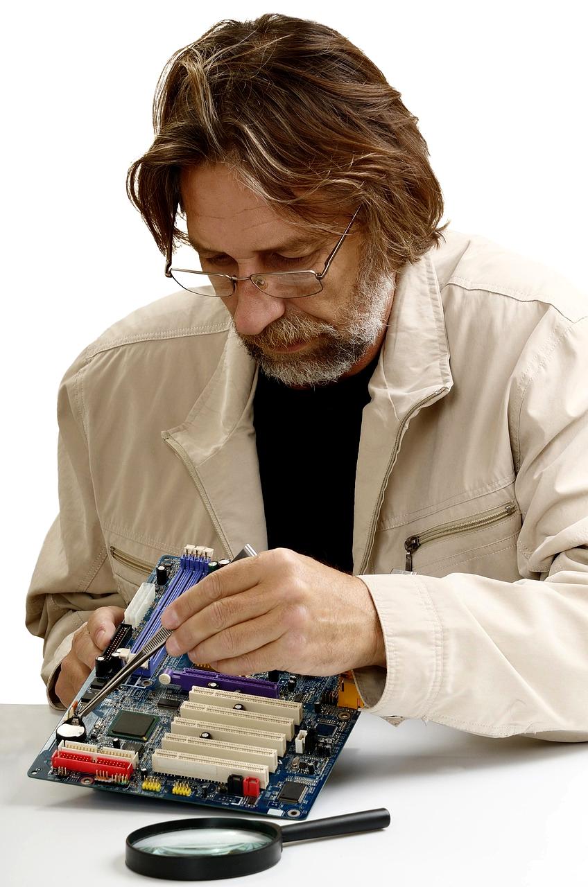 Technician repairing computer hardware